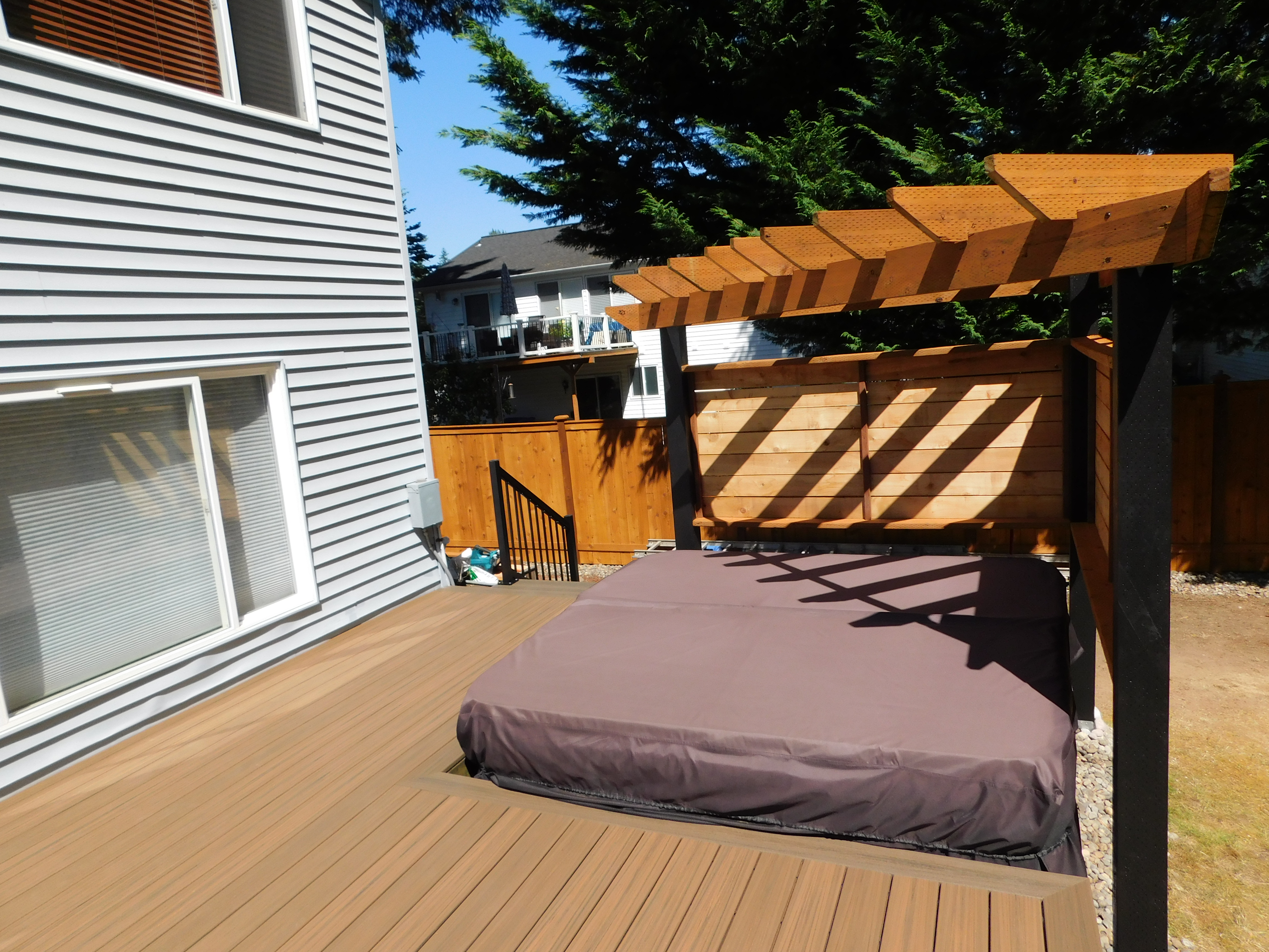 Deck layout showing pergola around hot tub and railing placement