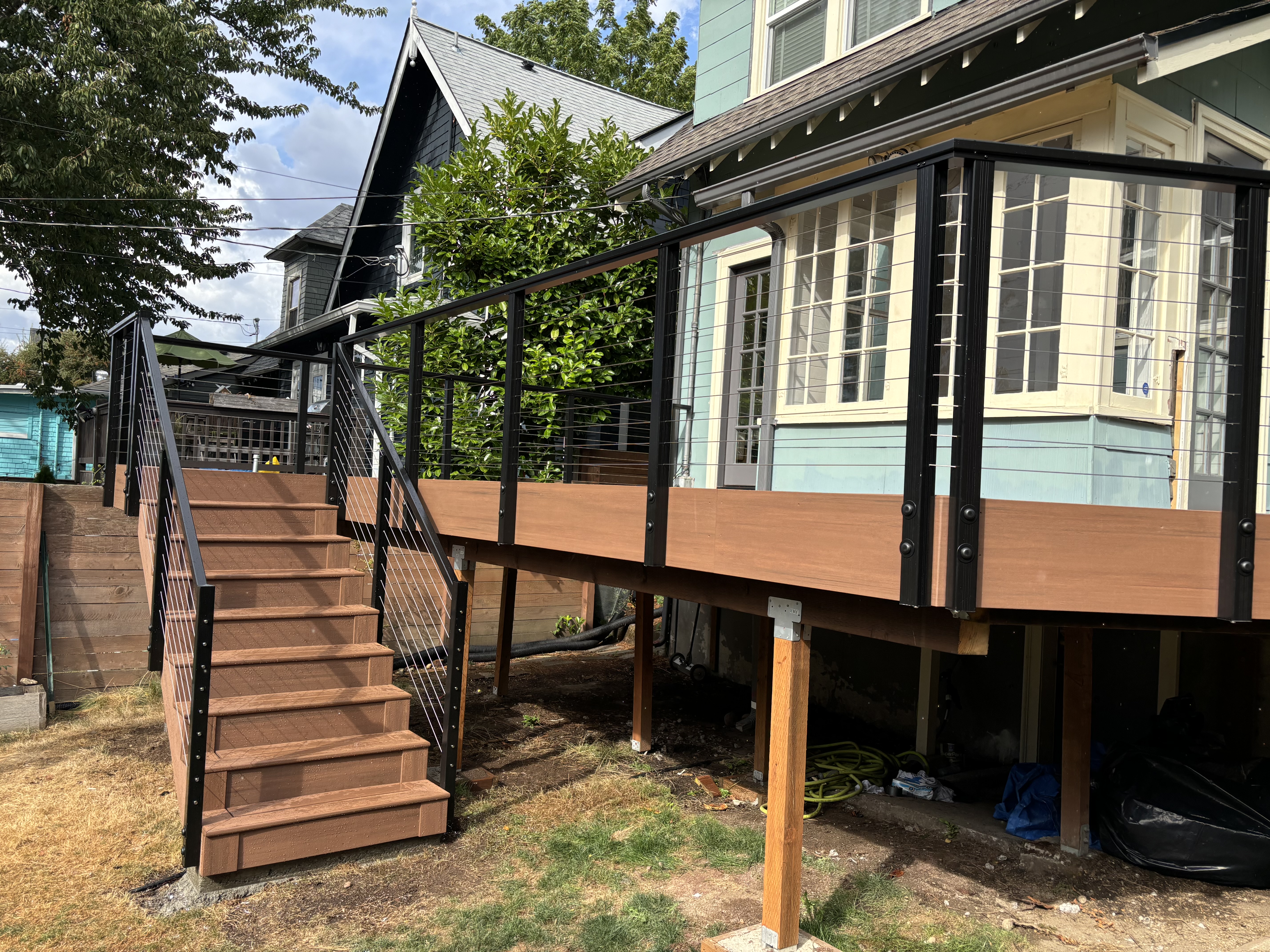 Deck overview showing TimberTech Mahogany PVC and cable railing