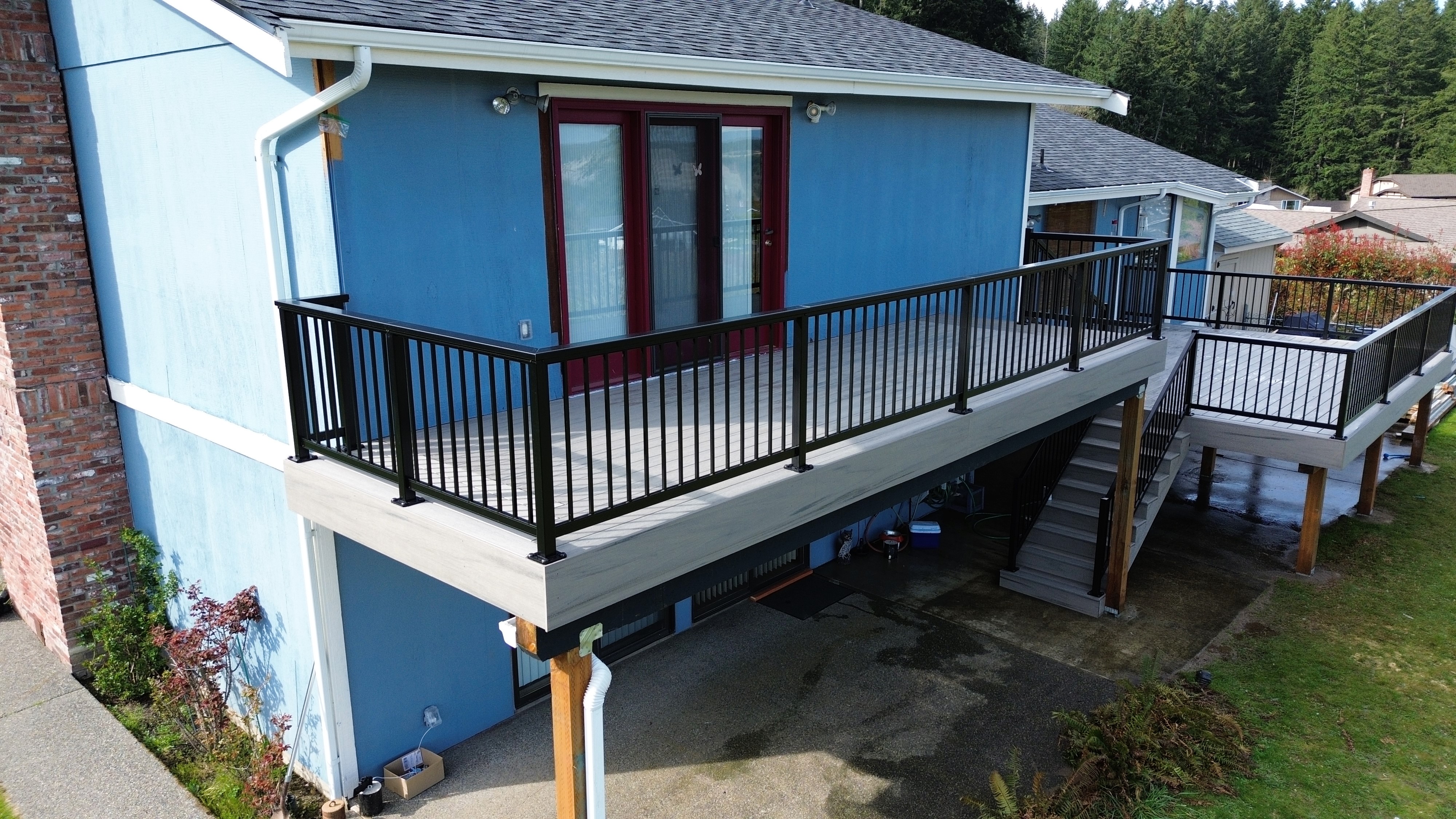 TimberTech Driftwood multi-level deck with black aluminum picket railing