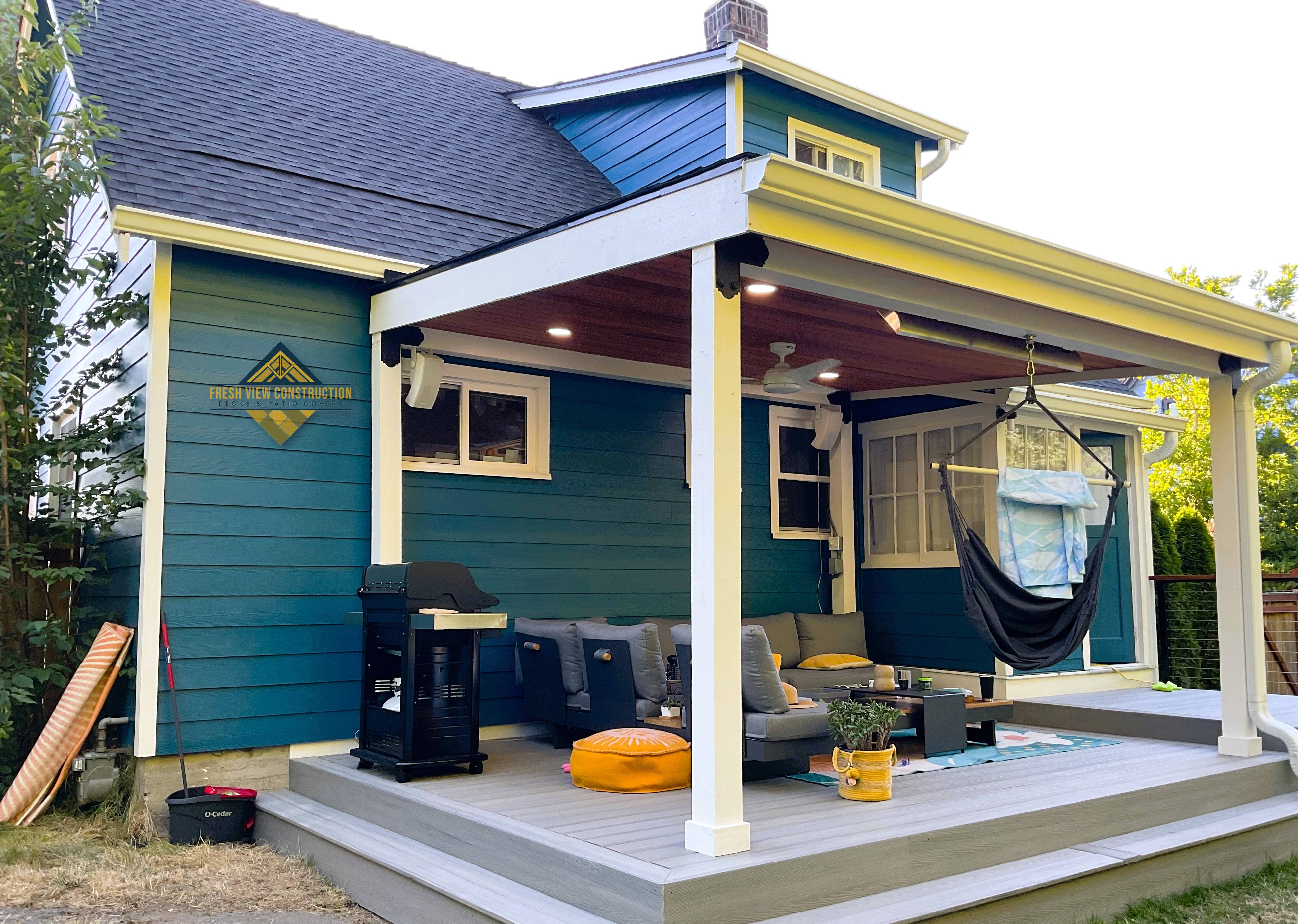 Covered deck with painted white posts and beams