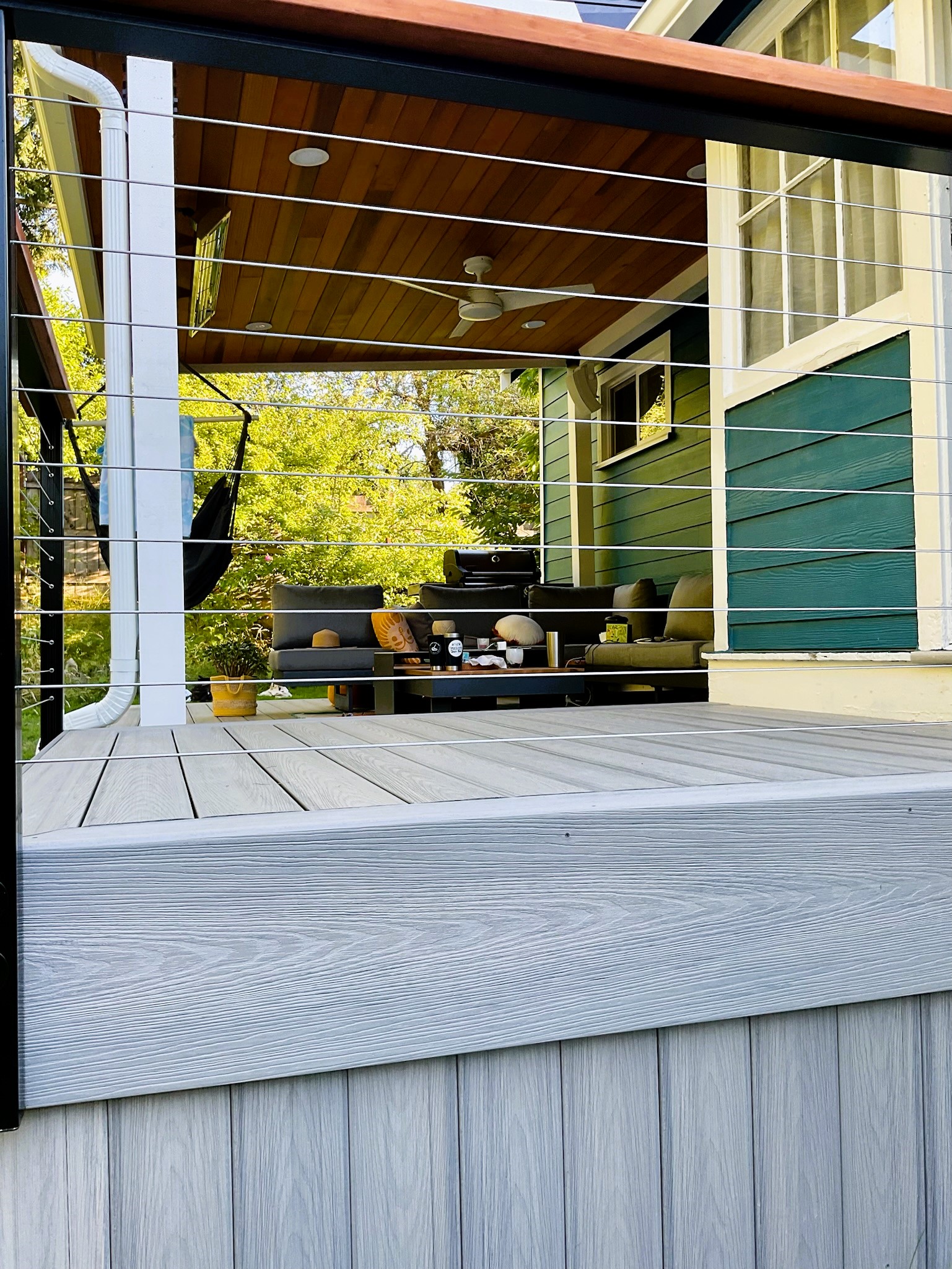 Finished North End covered deck with cedar ceiling and composite decking