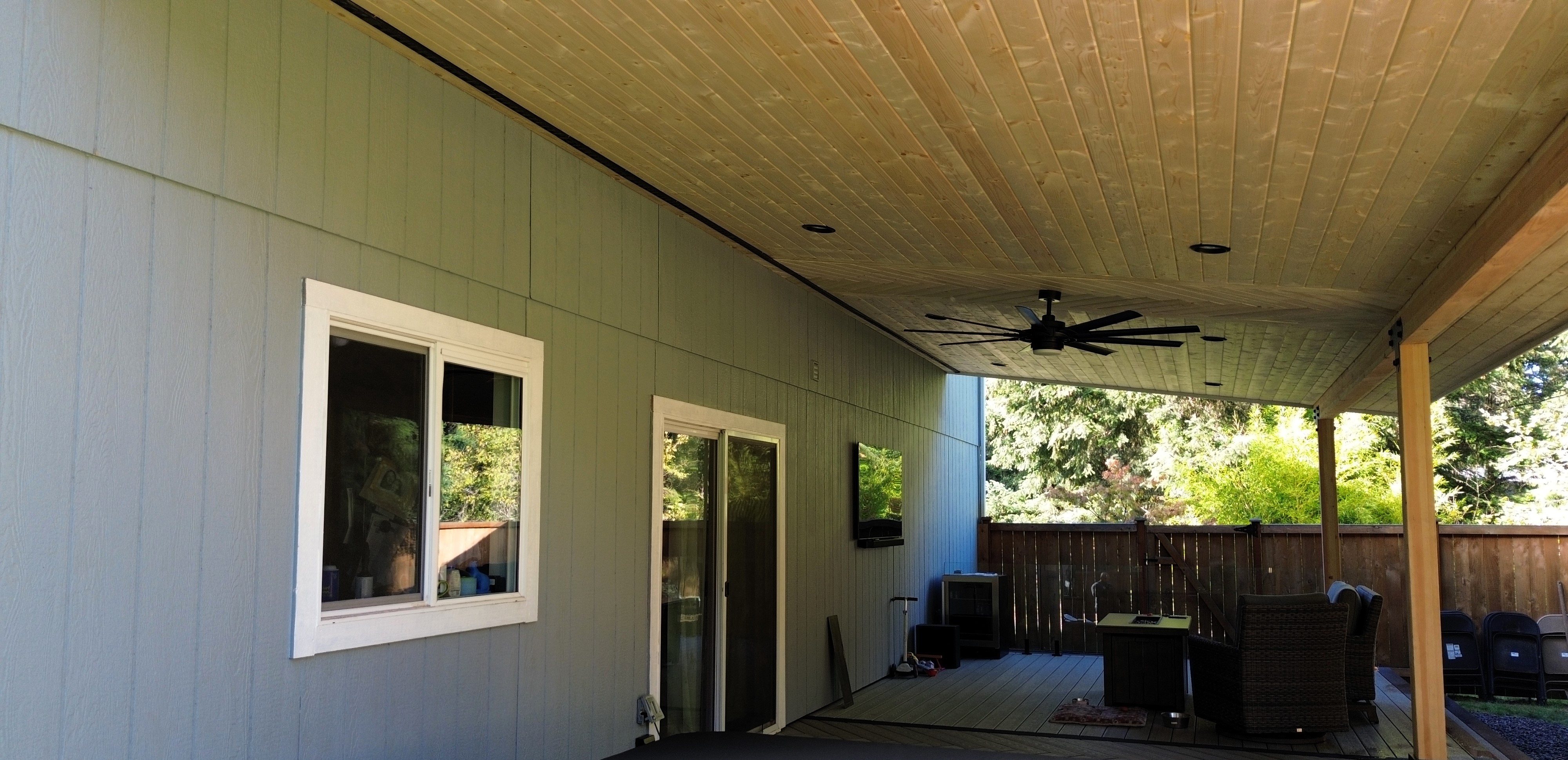 Finished covered deck in Spanaway WA with pine ceiling and custom details