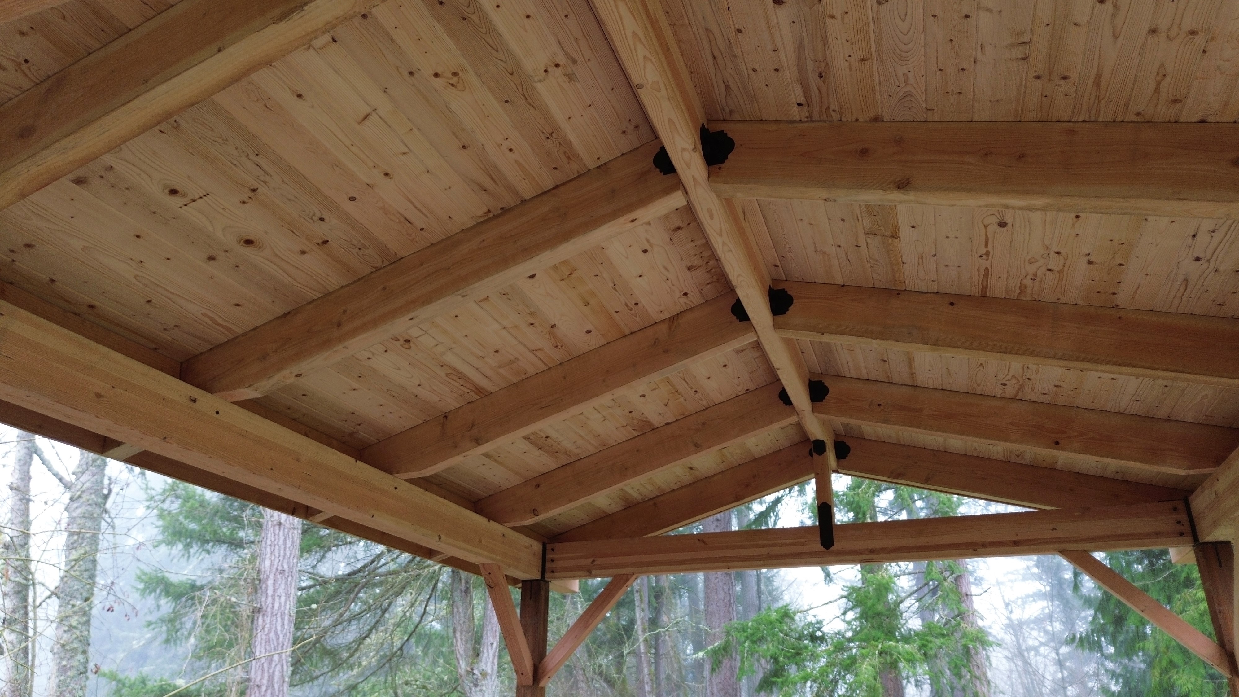 Deckorators Khaya decking paired with black aluminum cable railing