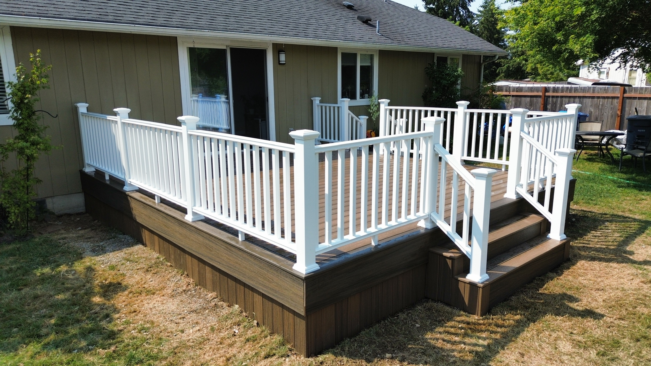 Two sets of stairs on Trex Toasted Sand deck for easy access
